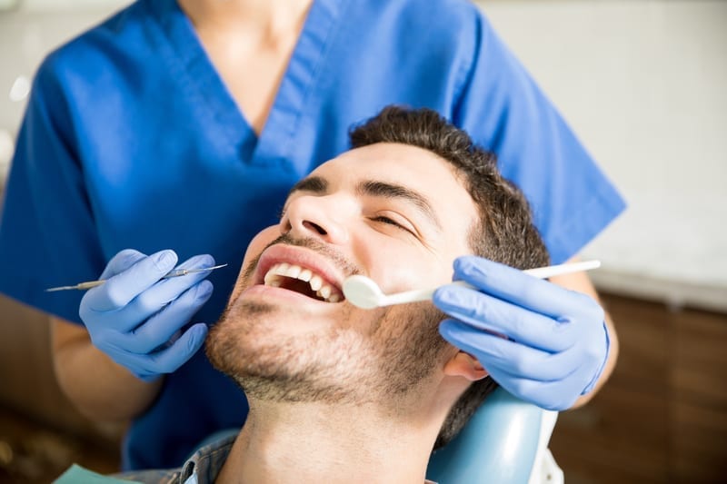 Young man getting a dental checkup