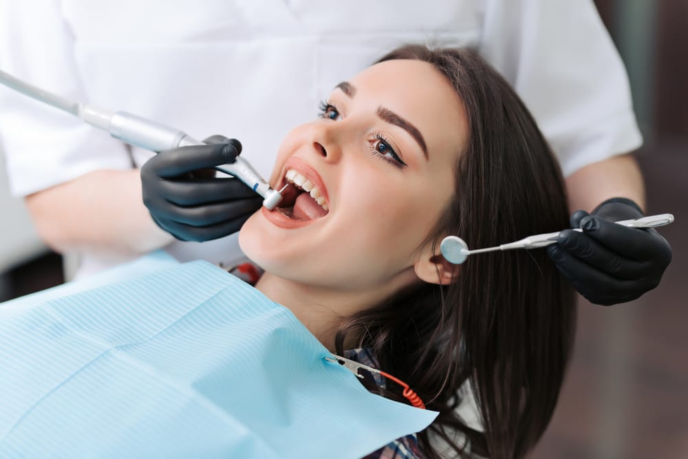 Woman getting check up at dentist